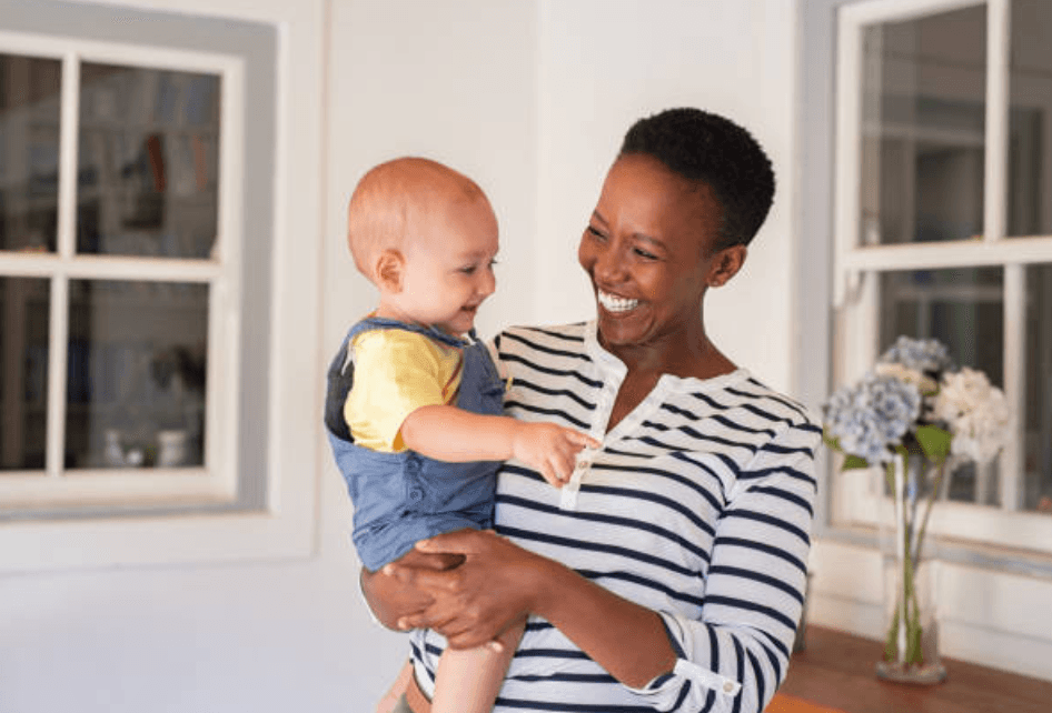 Caring babysitter with child